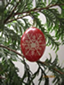 Hanging Christmas ornament pysanky on babasbeeswax.com