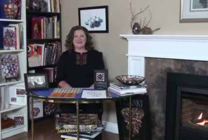 Joan Brander in her pysanky library at babasbeeswax.com